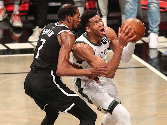 Milwaukee Bucks forward Giannis Antetokounmpo (34) drives past Brooklyn Nets forward Kevin Durant (7) in the third quarter during game seven in the second round of the 2021 NBA Playoffs
